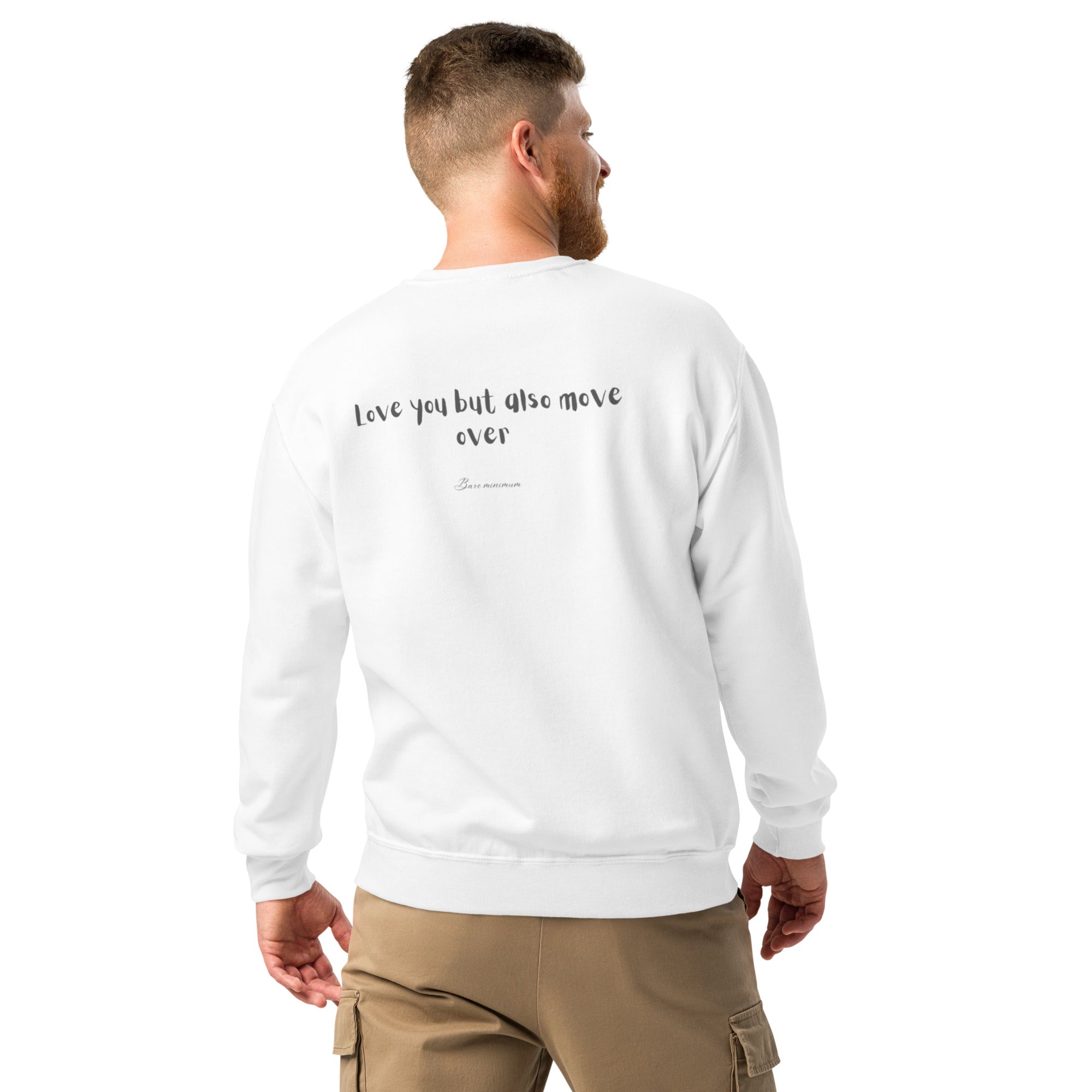 Man wearing a white sweatshirt with text on the back, standing against a white background