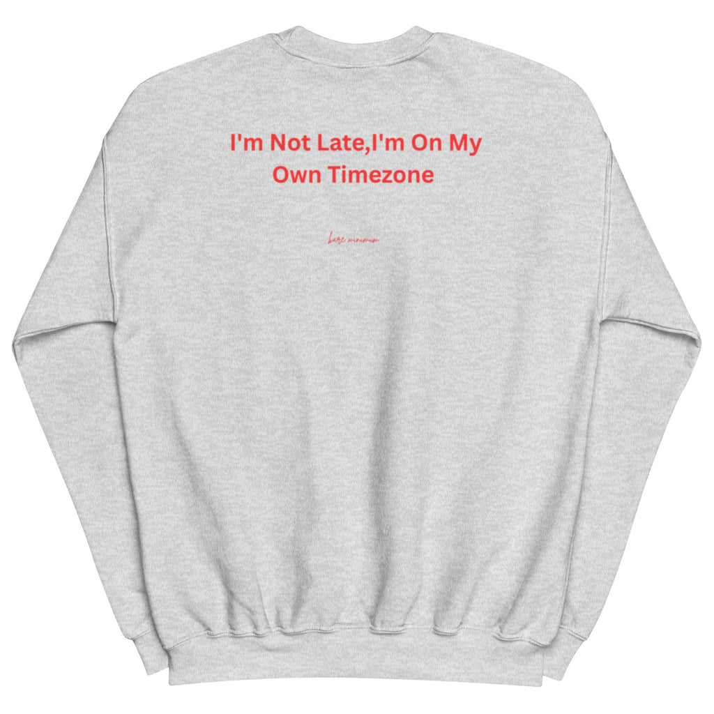 Gray sweatshirt with red text 'I'm Not Late, I'm On My Own Timezone' on a white background