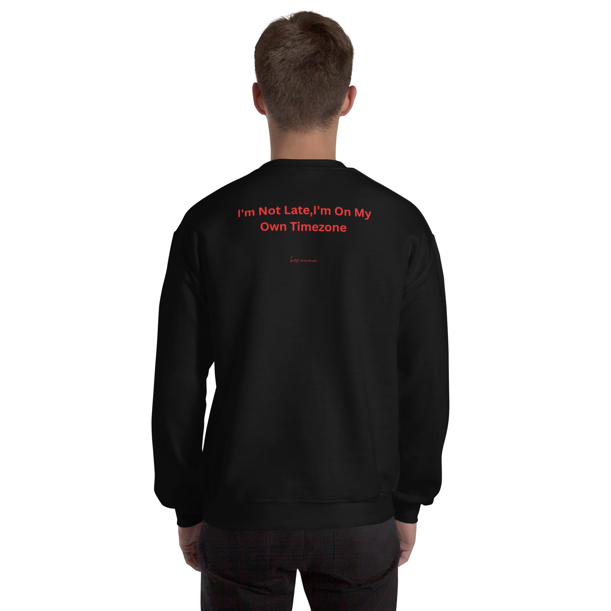 Black sweatshirt with red text on the back, worn by a person on a white background