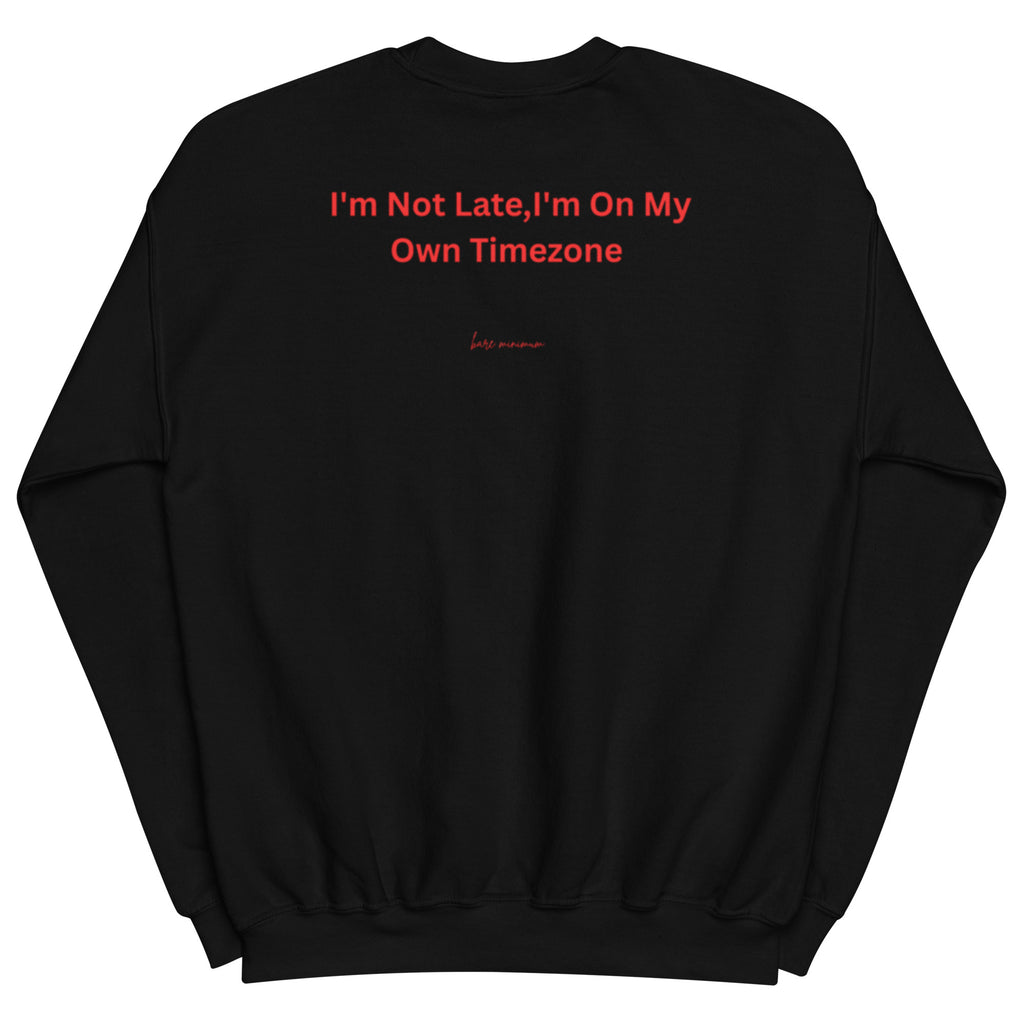 Black sweatshirt with red text 'I'm Not Late, I'm On My Own Timezone' on a white background