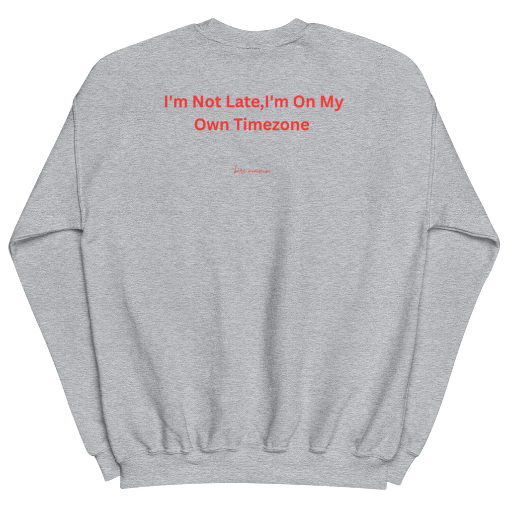 Gray sweatshirt with red text 'I'm Not Late, I'm On My Own Timezone' on a white background