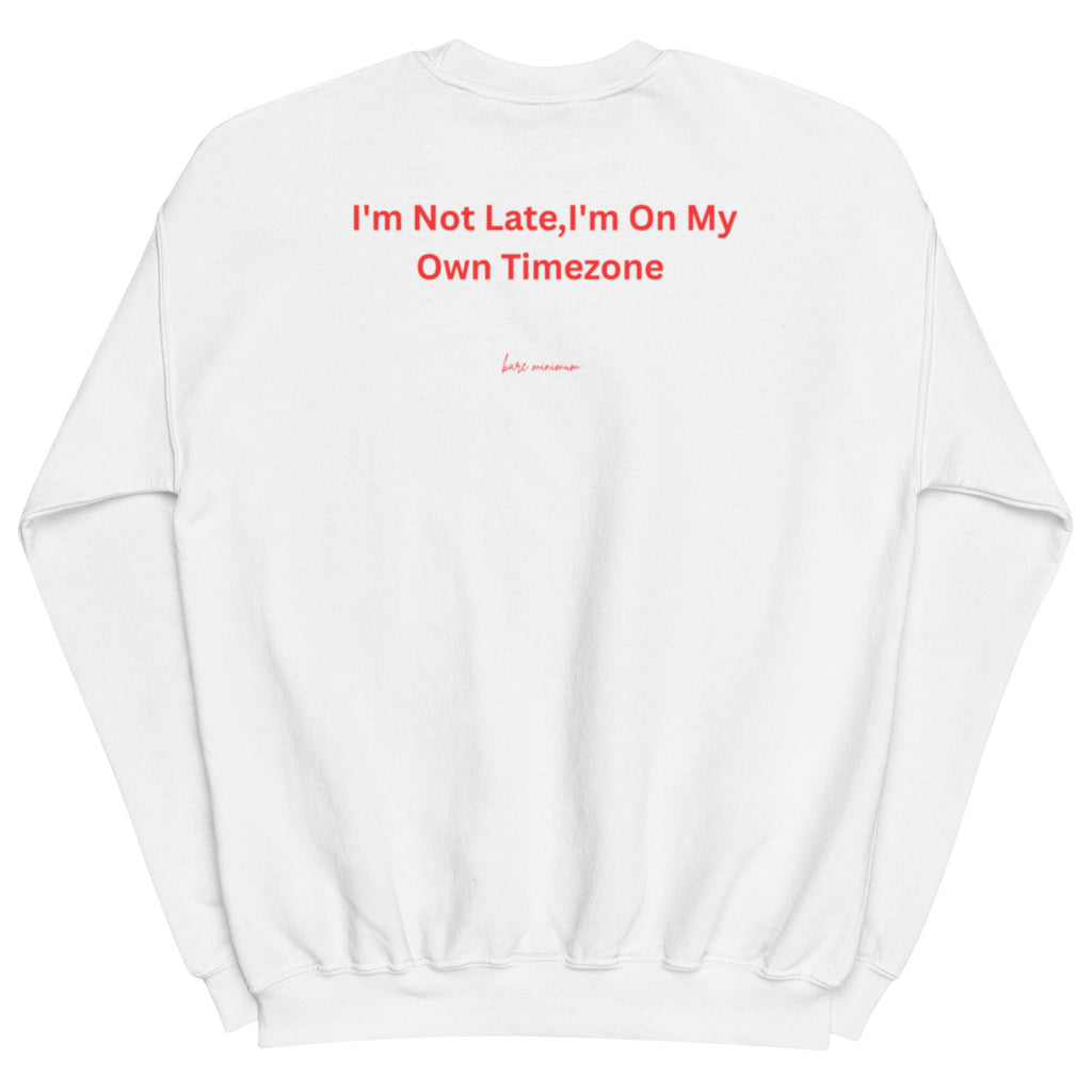 White sweatshirt with red text 'I'm Not Late, I'm On My Own Timezone' on a white background